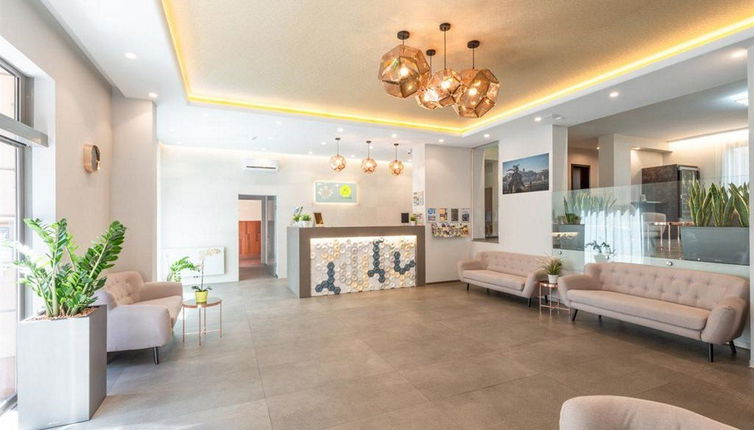 Photo 1 - Corvin Plaza Apartments & Suites