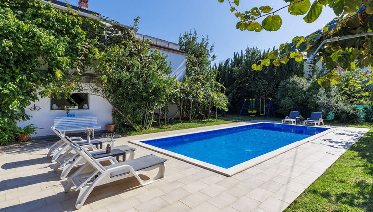 Photo 1 - Maison de 4 chambres à Umag avec piscine privée et jardin