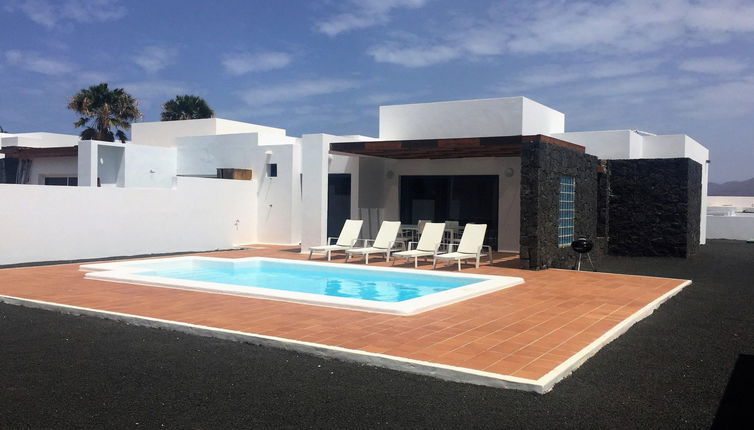 Foto 1 - Casa con 3 camere da letto a Yaiza con piscina privata e vista mare