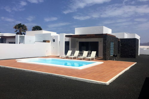 Foto 1 - Casa con 3 camere da letto a Yaiza con piscina privata e vista mare