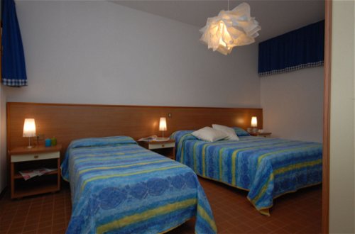 Foto 11 - Appartamento con 2 camere da letto a Lignano Sabbiadoro con giardino e vista mare