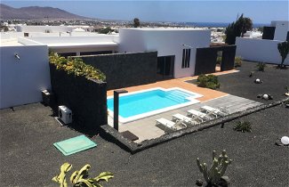 Foto 1 - Casa con 3 camere da letto a Yaiza con piscina privata e vista mare