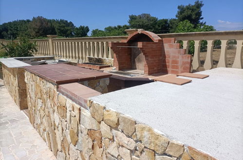 Photo 42 - Maison de 5 chambres à Torricella avec jardin et vues à la mer