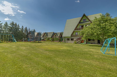 Foto 1 - Appartamento con 2 camere da letto a Bukowina Tatrzańska con piscina e vista sulle montagne