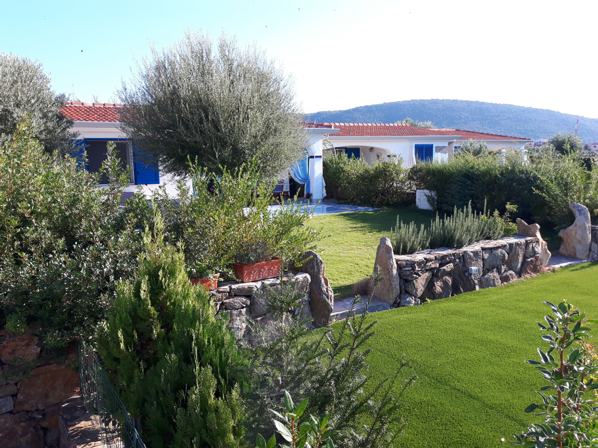 Photo 11 - Maison de 2 chambres à Budoni avec jardin et vues à la mer