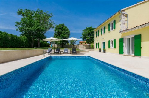 Photo 29 - Maison de 4 chambres à Tinjan avec piscine privée et vues à la mer