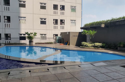 Photo 13 - Tranquil Green Pramuka 2BR Apartment near Shopping Center