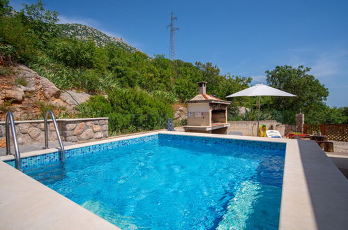 Photo 1 - Appartement de 1 chambre à Karlobag avec piscine et jardin