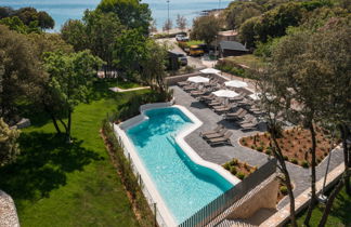 Foto 2 - Casa con 2 camere da letto a Bale con piscina e vista mare
