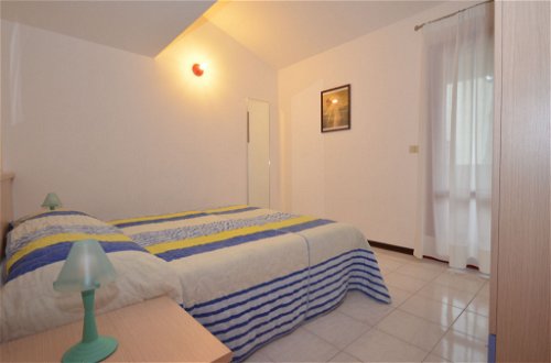 Foto 10 - Casa con 4 camere da letto a Lignano Sabbiadoro con piscina e vista mare