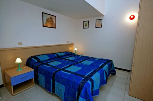 Foto 12 - Casa con 4 camere da letto a Lignano Sabbiadoro con piscina e vista mare