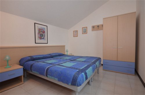 Foto 17 - Casa con 3 camere da letto a Lignano Sabbiadoro con piscina e vista mare