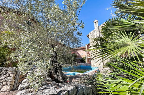 Foto 42 - Casa con 3 camere da letto a Lignano Sabbiadoro con piscina e giardino