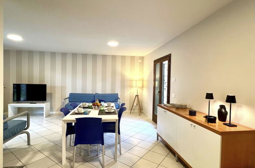 Foto 9 - Casa con 3 camere da letto a Lignano Sabbiadoro con piscina e giardino