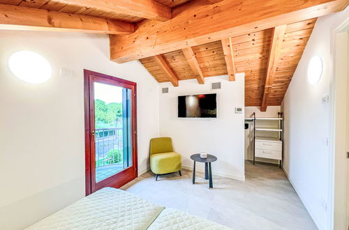 Foto 31 - Casa con 3 camere da letto a Lignano Sabbiadoro con piscina e giardino