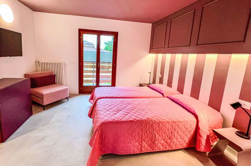 Foto 16 - Casa con 3 camere da letto a Lignano Sabbiadoro con piscina e giardino