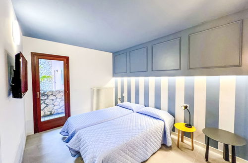 Foto 19 - Casa con 3 camere da letto a Lignano Sabbiadoro con piscina e giardino