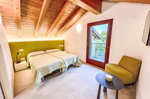 Foto 30 - Casa con 3 camere da letto a Lignano Sabbiadoro con piscina e giardino