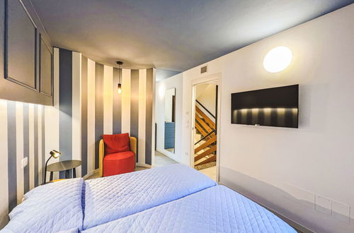 Foto 5 - Casa con 3 camere da letto a Lignano Sabbiadoro con piscina e giardino