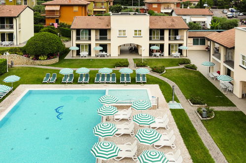 Foto 38 - Apartamento de 2 quartos em Garda com piscina e vista para a montanha