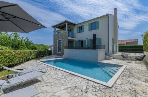 Foto 1 - Casa de 4 habitaciones en Buje con piscina privada y vistas al mar