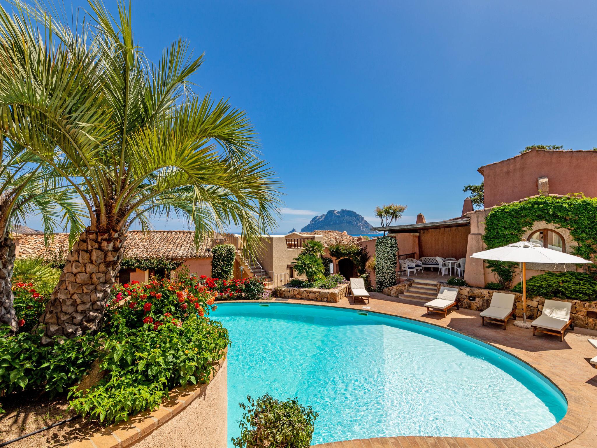 Photo 1 - Maison de 1 chambre à Loiri Porto San Paolo avec piscine et vues à la mer