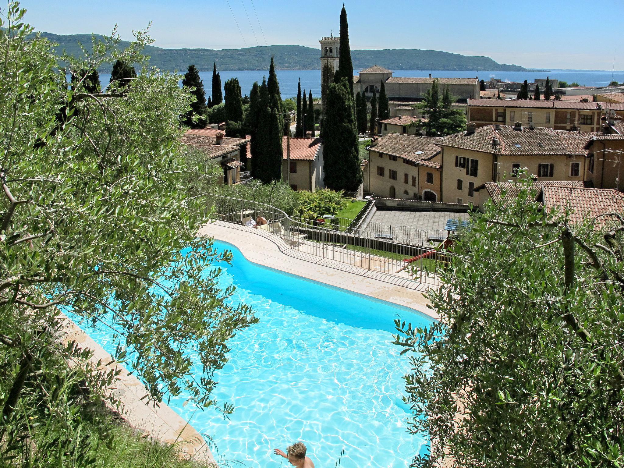 Foto 1 - Apartamento de 1 quarto em Toscolano Maderno com piscina e vista para a montanha
