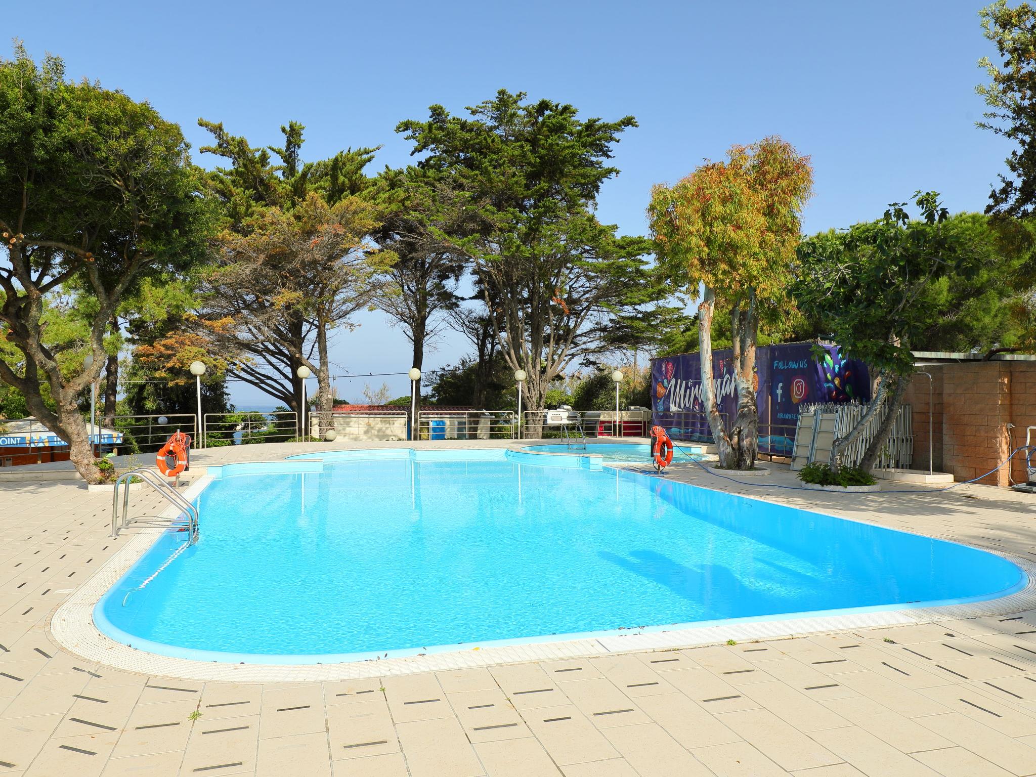 Foto 10 - Casa de 2 habitaciones en Livorno con piscina y vistas al mar