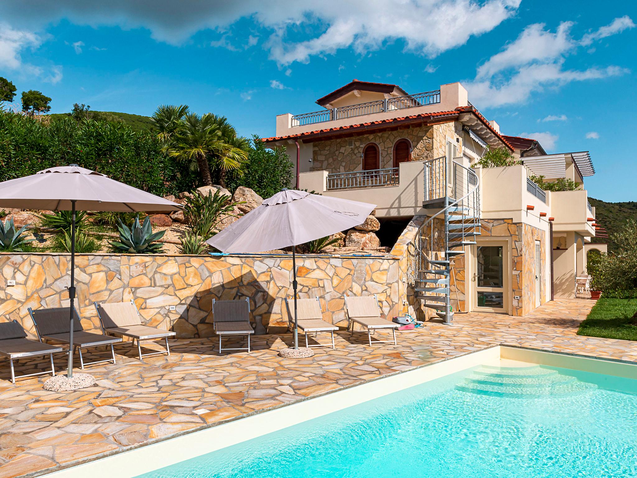 Foto 1 - Apartamento em Capoliveri com piscina e vistas do mar