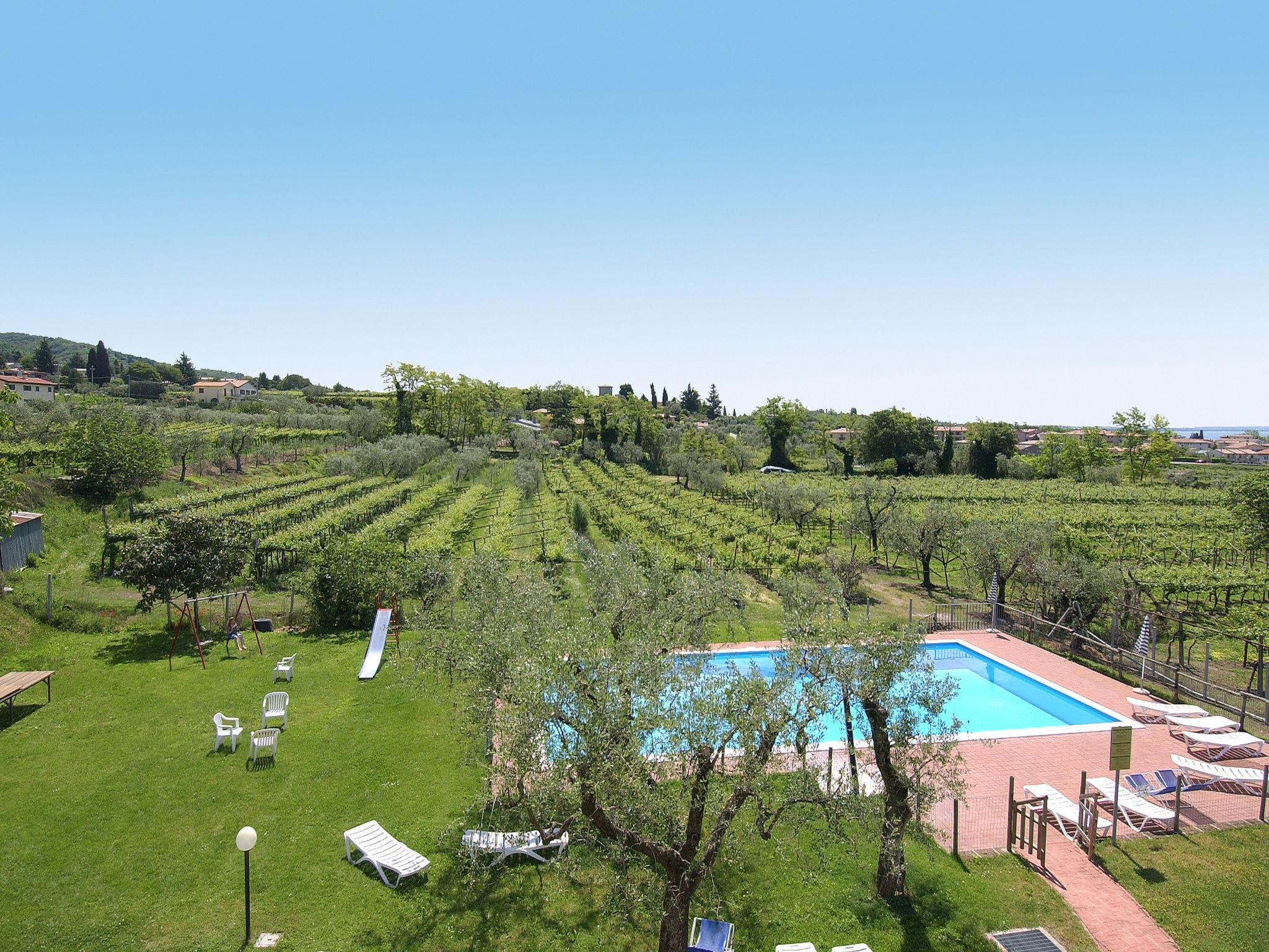 Foto 2 - Apartamento de 1 habitación en Bardolino con piscina y jardín