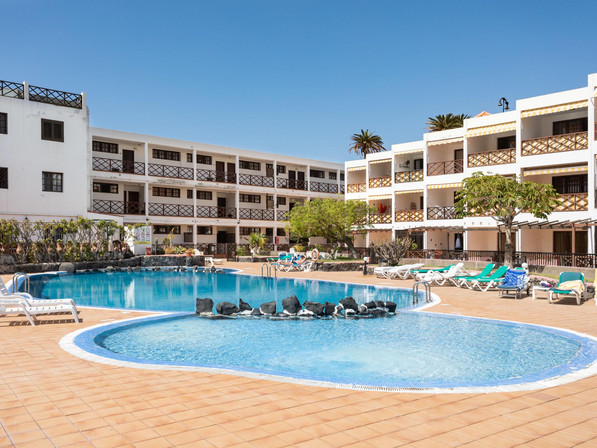 Foto 1 - Apartment mit 1 Schlafzimmer in Santiago del Teide mit schwimmbad und blick aufs meer