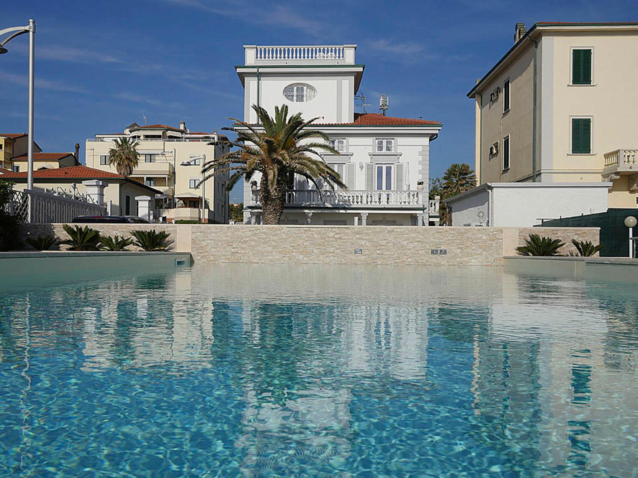 Foto 1 - Apartamento em San Vincenzo com piscina e vistas do mar
