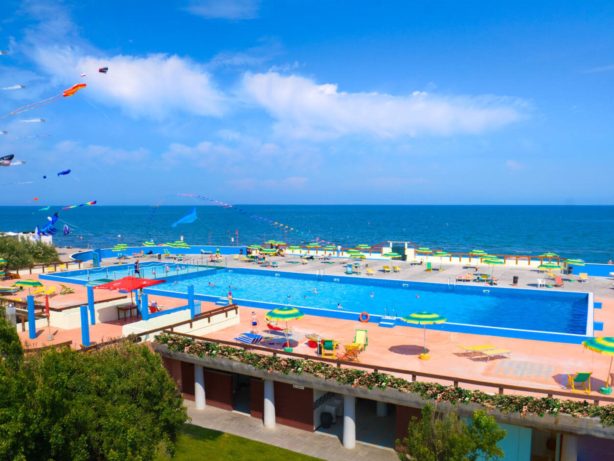 Photo 3 - Maison de 3 chambres à Rosolina avec piscine et vues à la mer