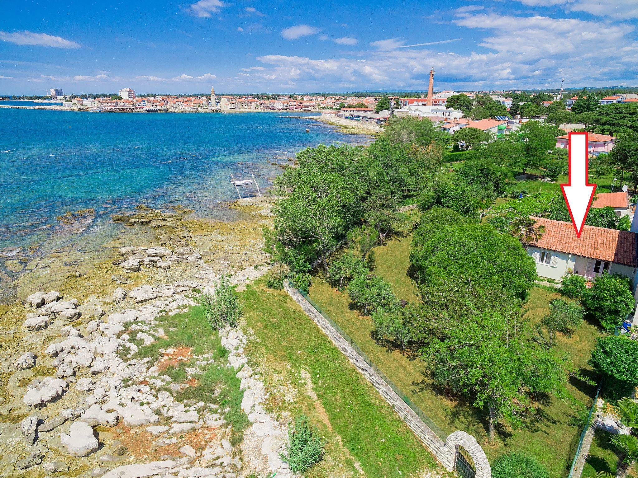 Foto 1 - Casa de 2 habitaciones en Umag con jardín y vistas al mar