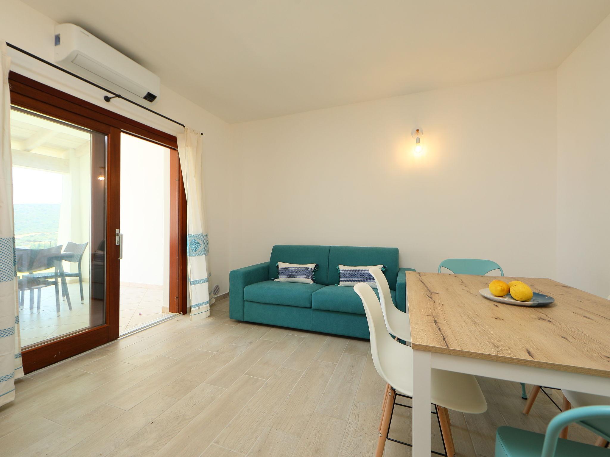 Photo 8 - Appartement de 2 chambres à Budoni avec piscine et vues à la mer