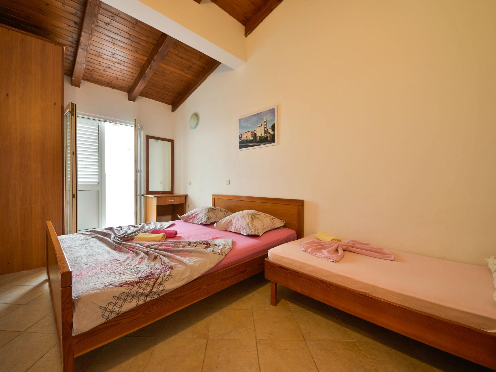 Foto 7 - Appartamento con 3 camere da letto a Kali con piscina e vista mare