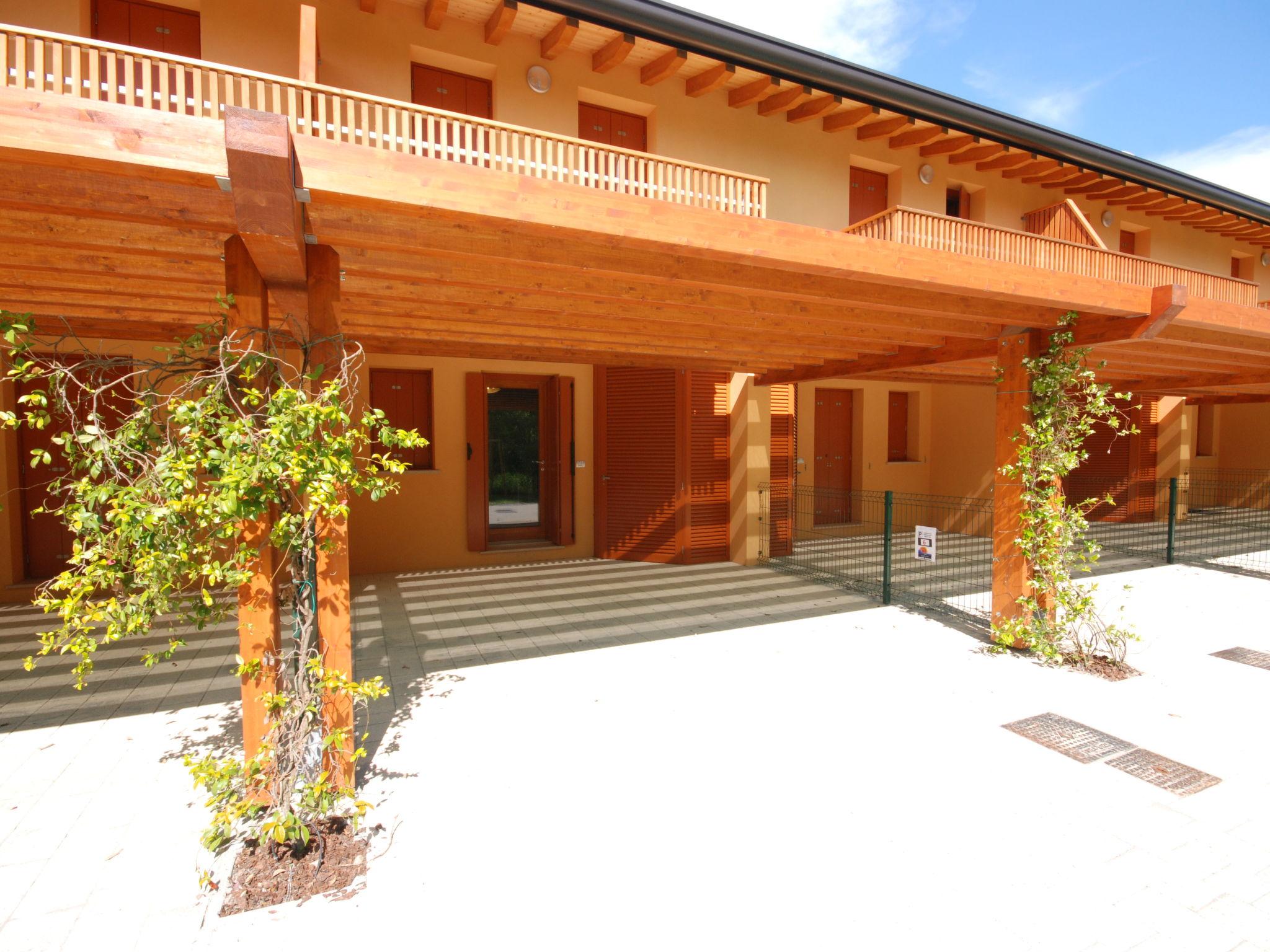 Photo 31 - Maison de 2 chambres à Lignano Sabbiadoro avec piscine et vues à la mer