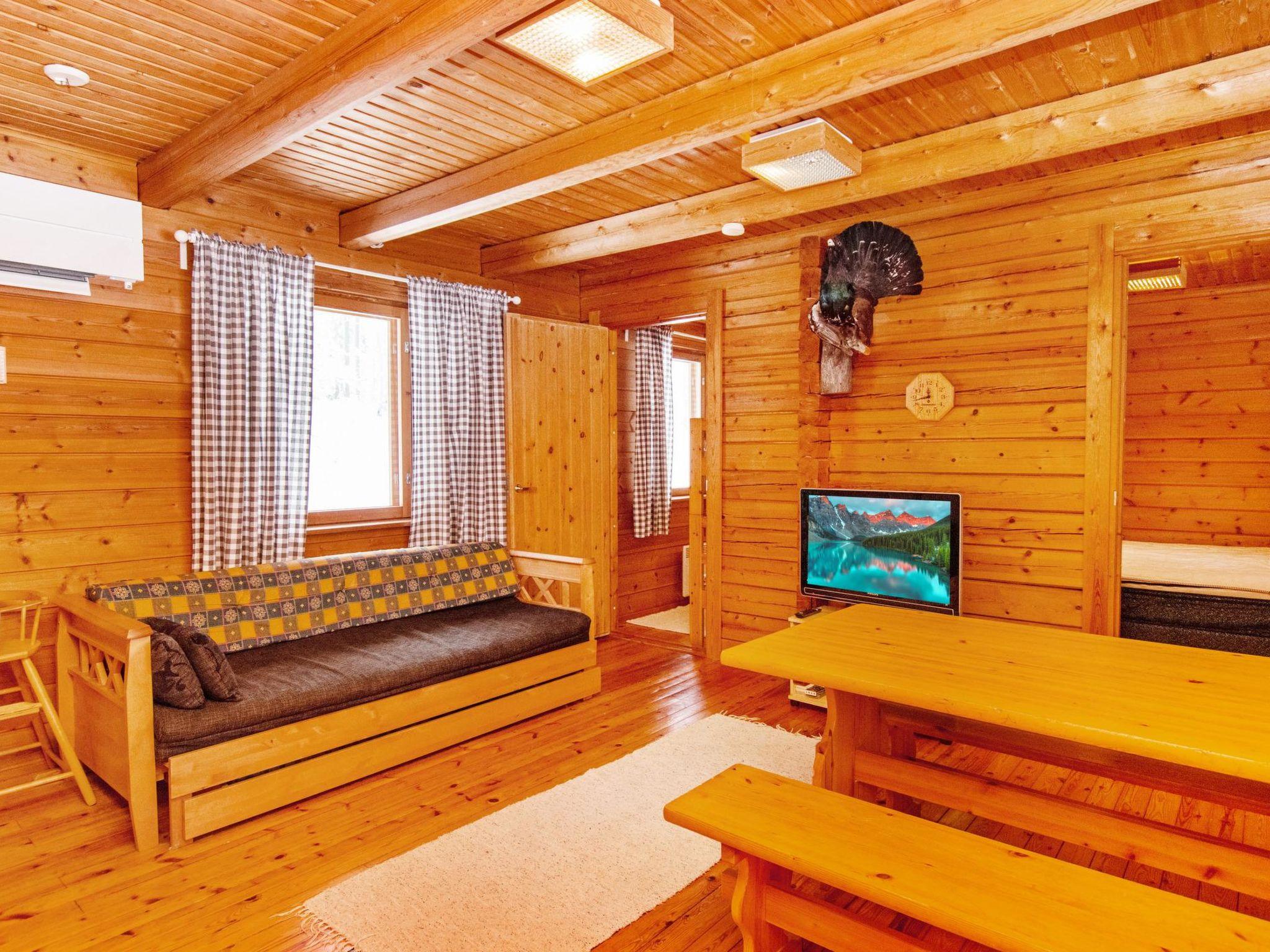 Foto 4 - Casa de 2 habitaciones en Puolanka con sauna y vistas a la montaña