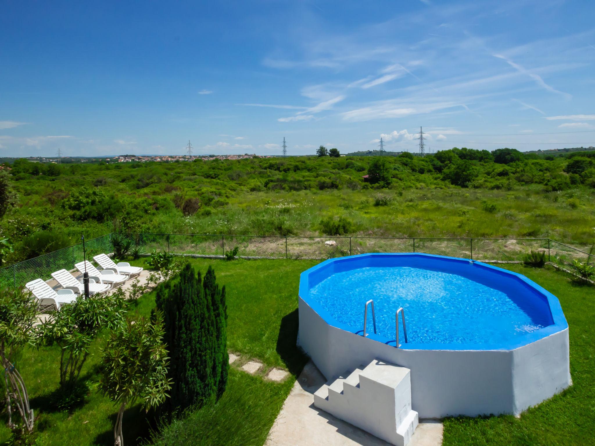 Foto 2 - Casa de 3 habitaciones en Pula con piscina privada y vistas al mar