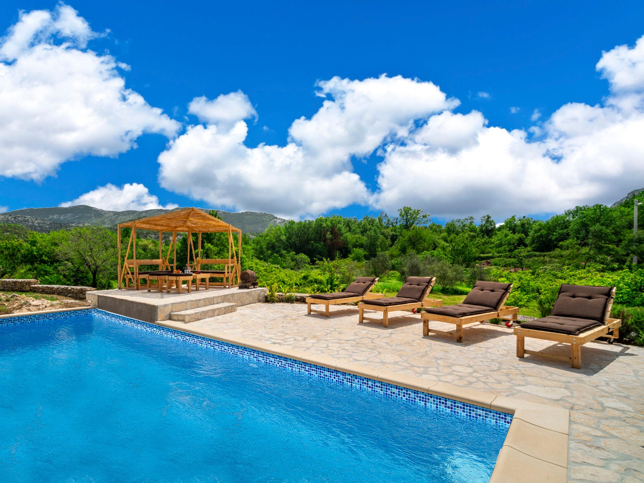 Photo 6 - Maison de 3 chambres à Brela avec piscine privée et vues à la mer