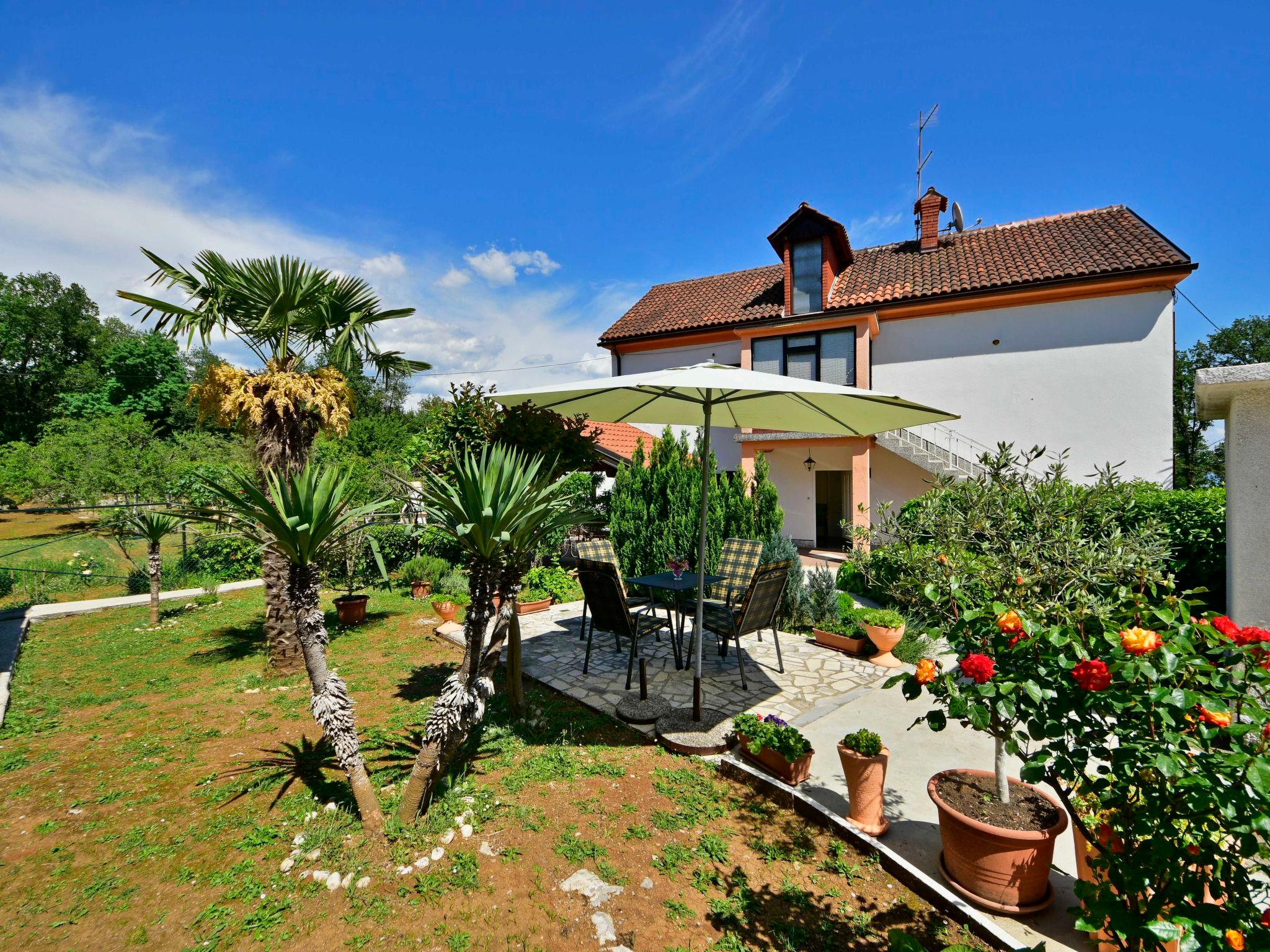 Photo 1 - Appartement de 2 chambres à Opatija avec jardin et vues à la mer