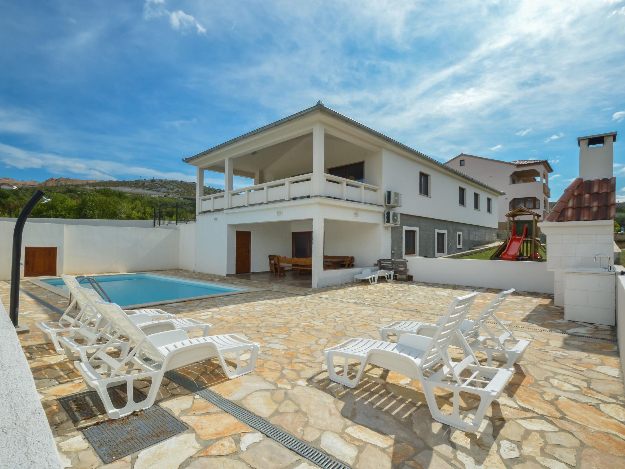 Photo 1 - Maison de 4 chambres à Jasenice avec piscine privée et vues à la mer