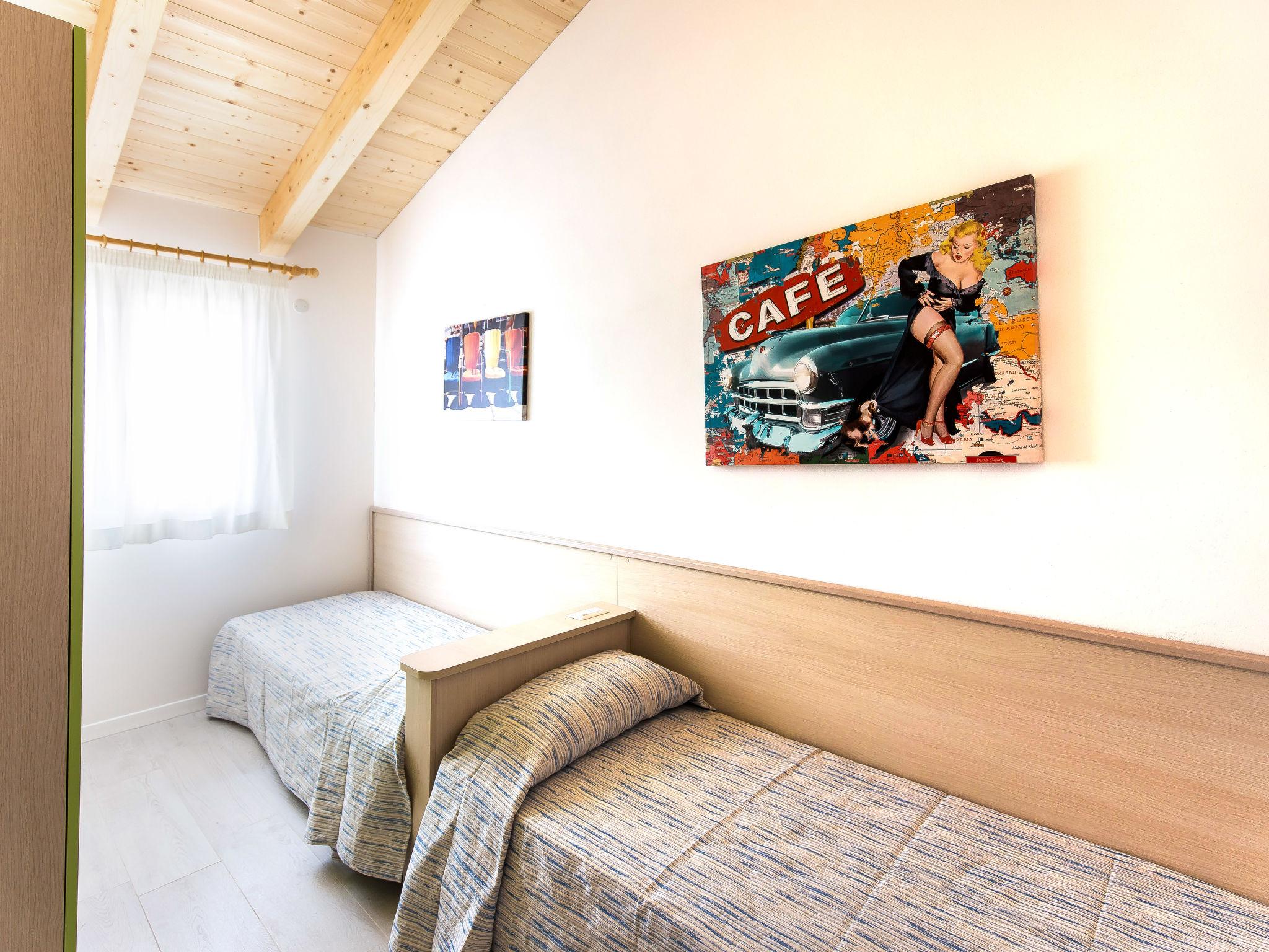 Foto 11 - Appartamento con 2 camere da letto a Caorle con piscina e vista mare