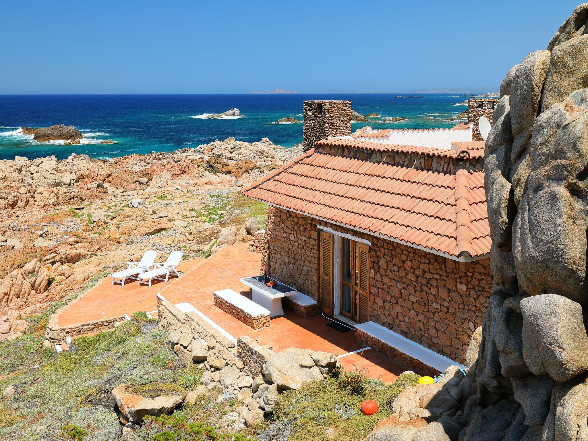 Photo 1 - Maison de 3 chambres à Aglientu avec terrasse et vues à la mer