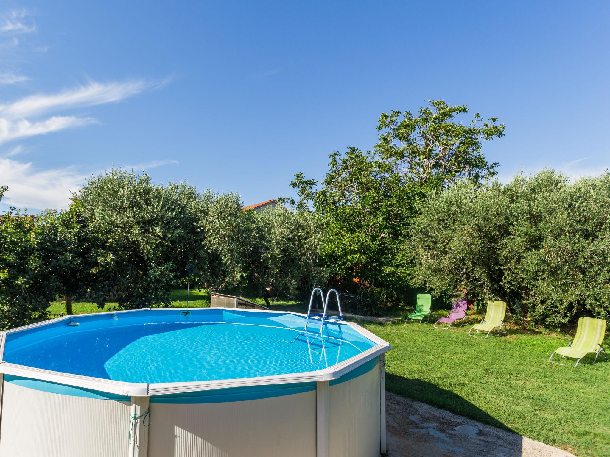 Photo 1 - Appartement de 3 chambres à Umag avec piscine et vues à la mer