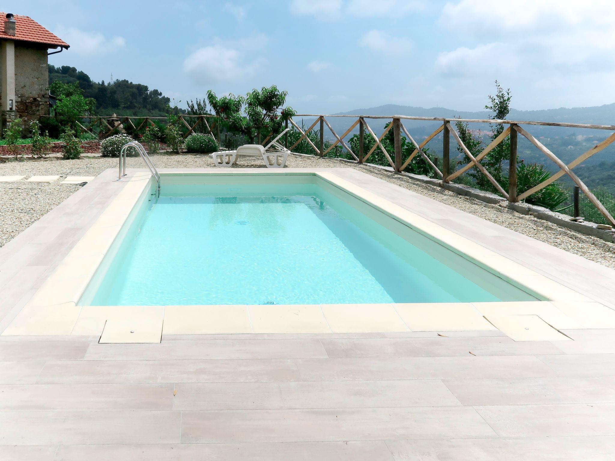 Photo 1 - Maison de 1 chambre à Diano San Pietro avec piscine privée et vues à la mer