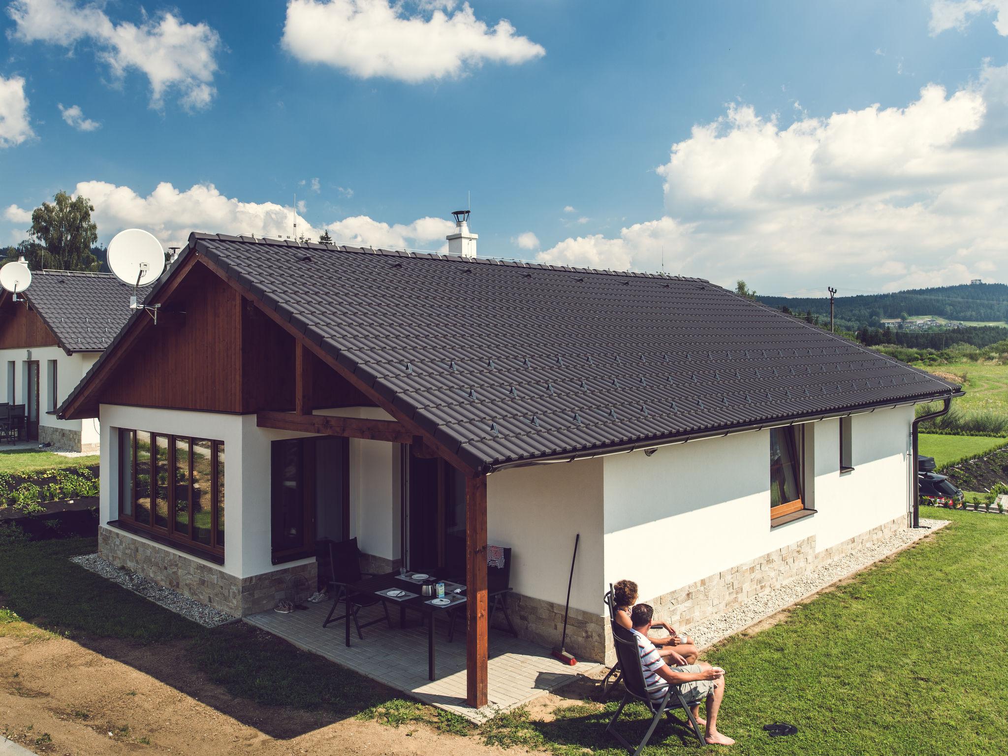 Foto 1 - Casa con 2 camere da letto a Lipno nad Vltavou con giardino e vista sulle montagne