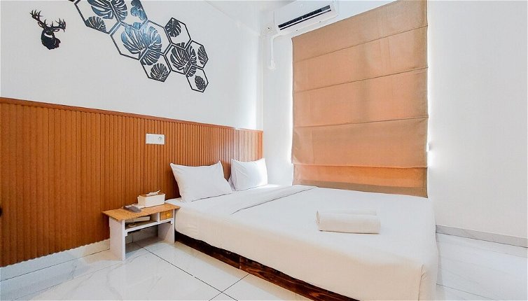 Photo 1 - Comfy And Modern Studio At Sky House Alam Sutera Apartment
