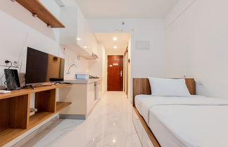 Photo 1 - Homey And Warm Studio Room At Sky House Bsd Apartment