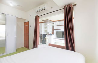 Photo 2 - Comfort 1Br At Vida View Makassar Apartment